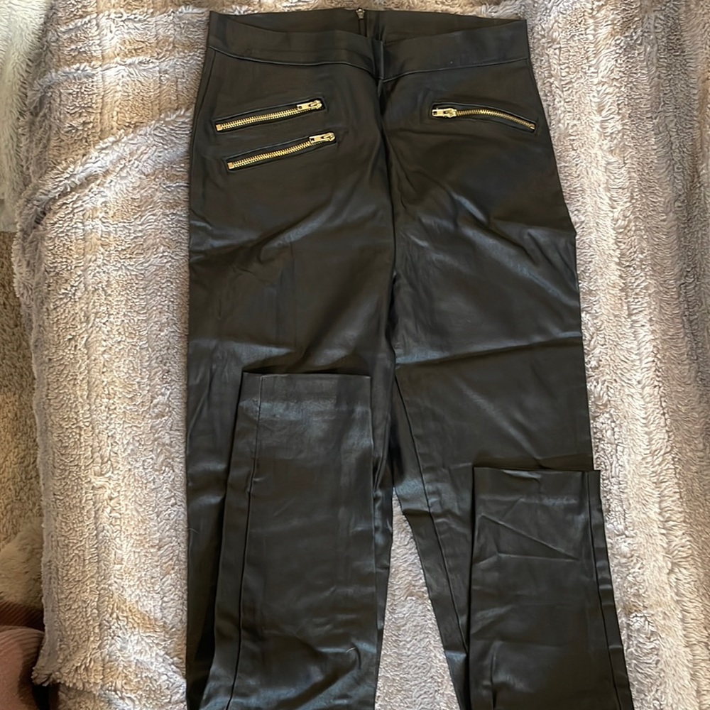 Medium Charlotte Russe leather leggings with gold zipper detail. Excellent